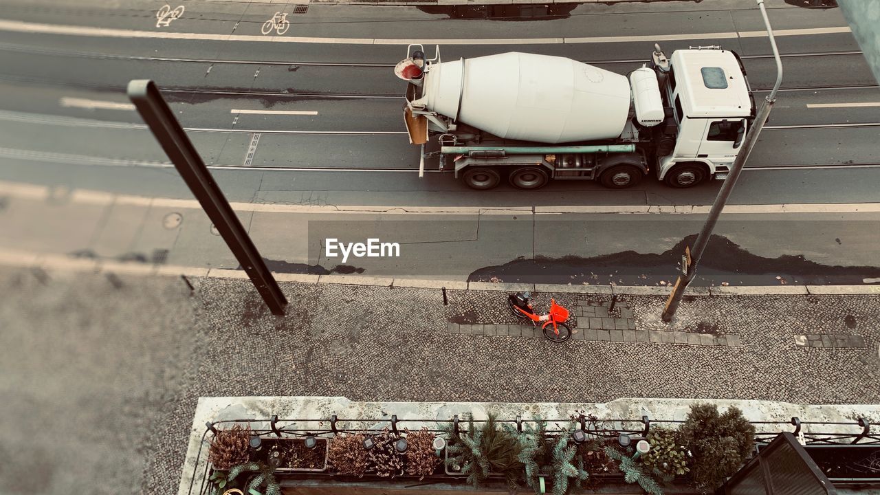 HIGH ANGLE VIEW OF WORKING ON STREET