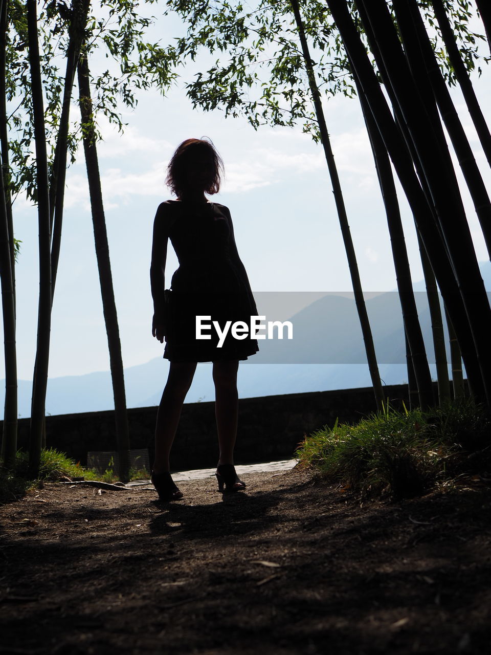 FULL LENGTH OF WOMAN STANDING ON LAND