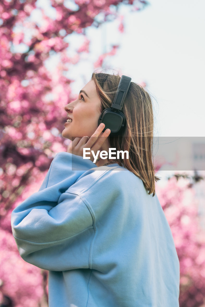 side view of young woman looking away