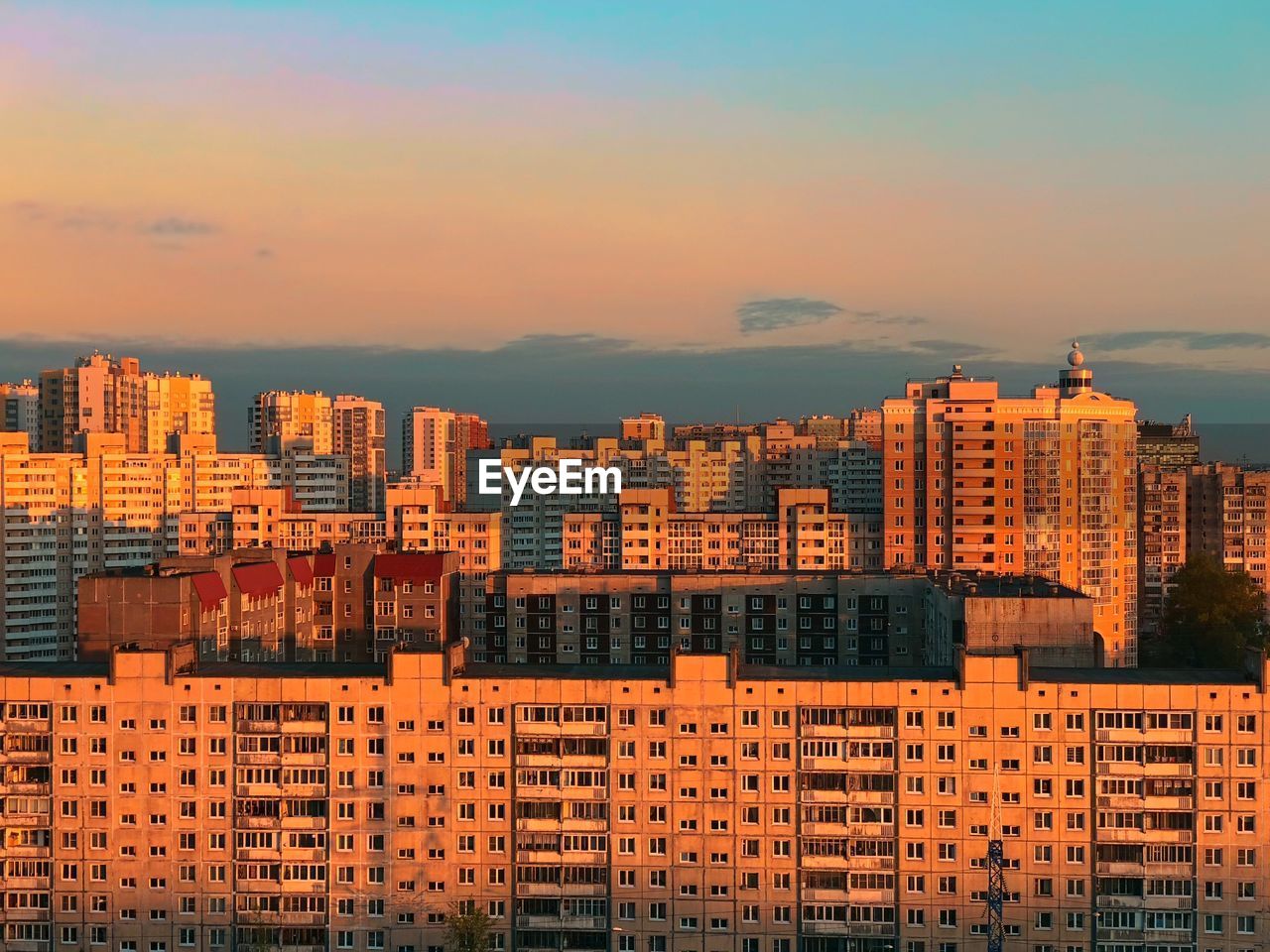 BUILDINGS AGAINST SKY DURING SUNSET