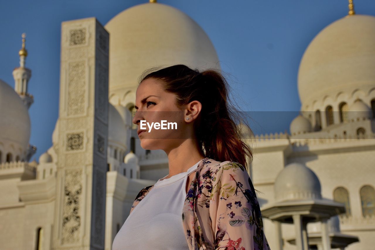 Low angle view of woman against the sky