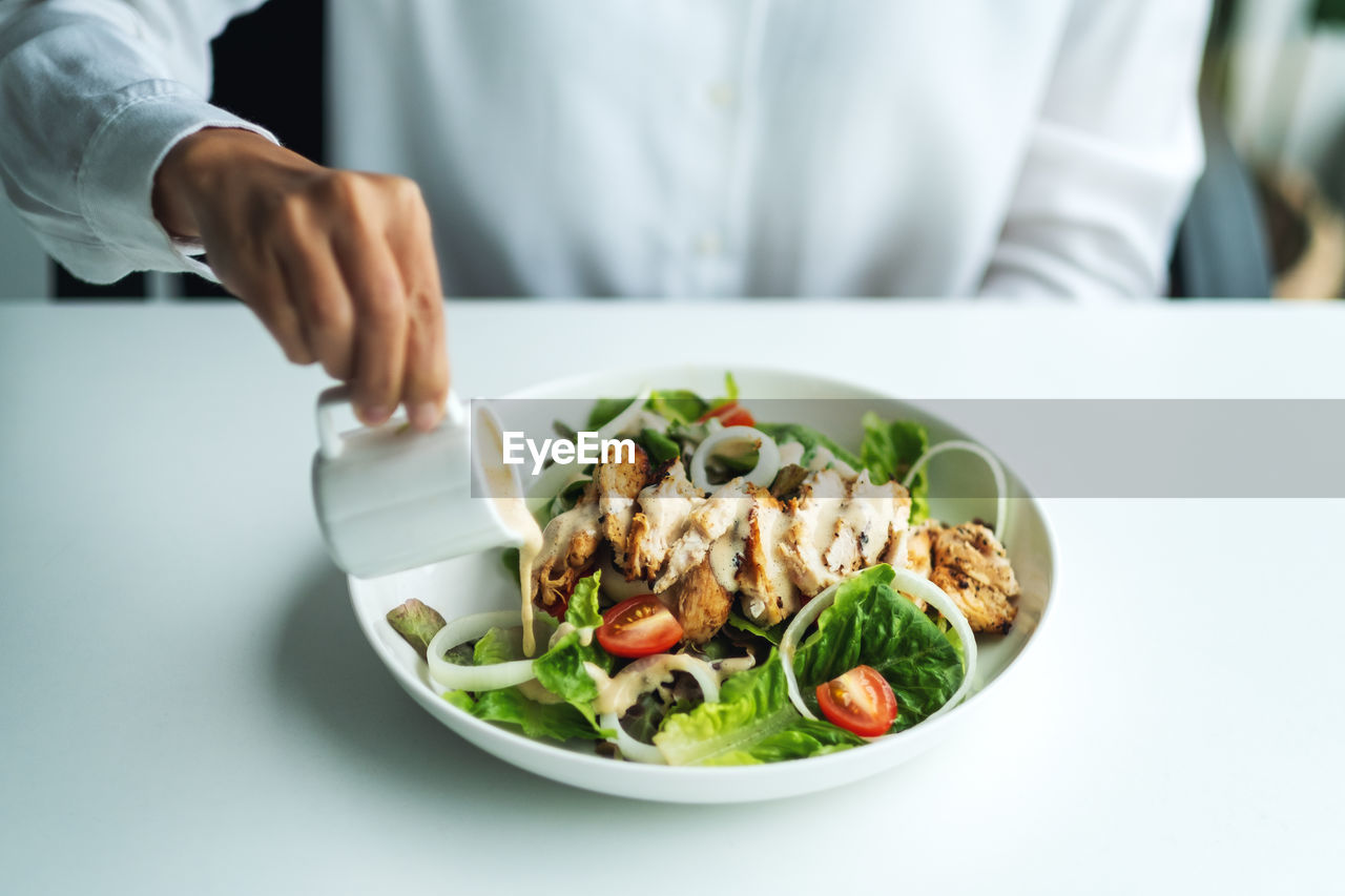 midsection of woman holding food