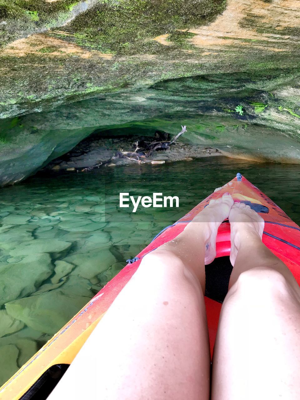 LOW SECTION OF WOMAN IN SWIMMING POOL