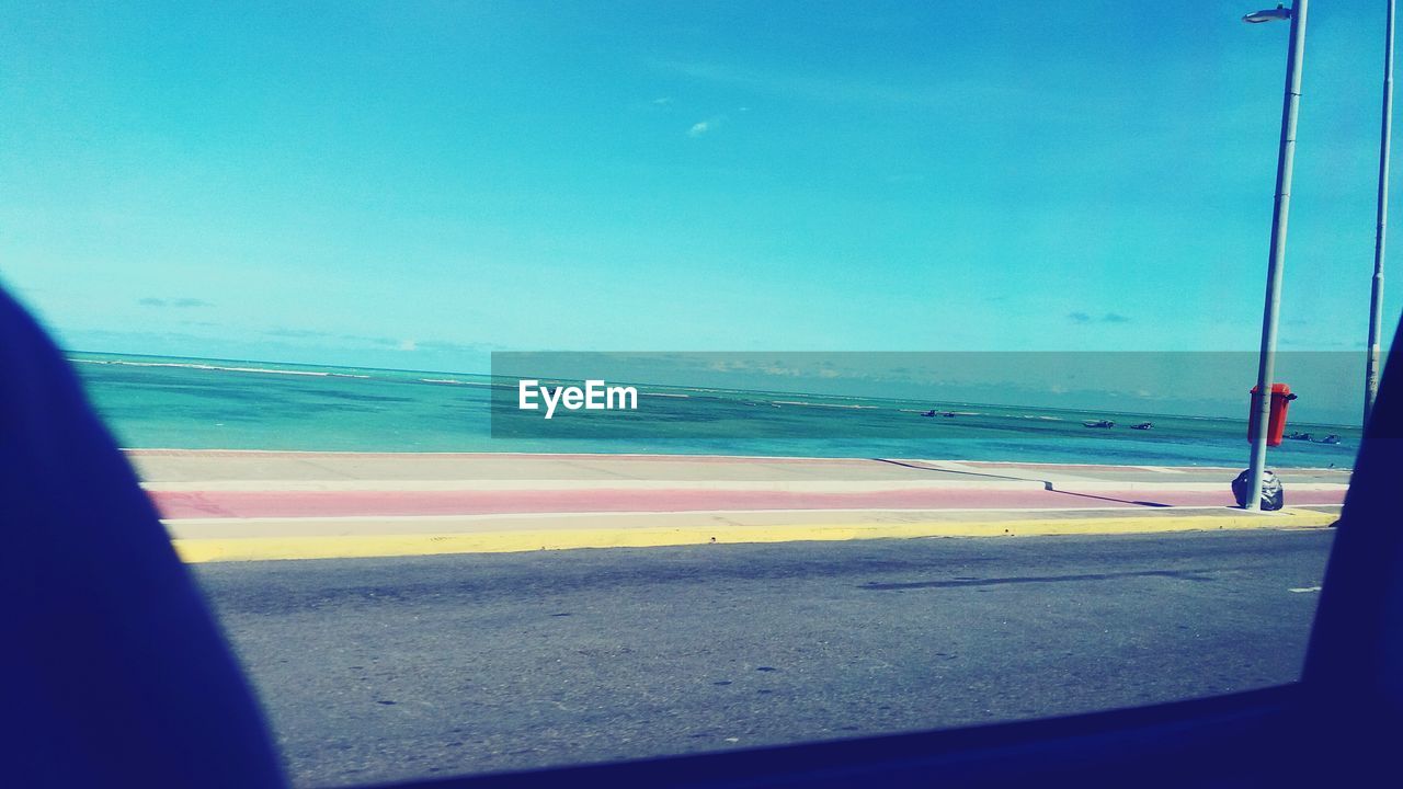 BEACH AGAINST CLEAR BLUE SKY