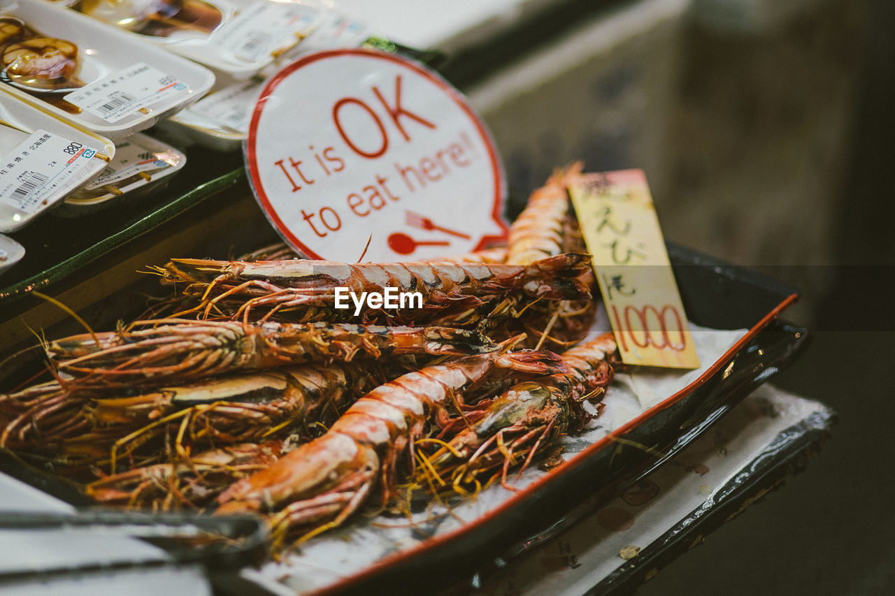 HIGH ANGLE VIEW OF SEAFOOD FOR SALE IN MARKET