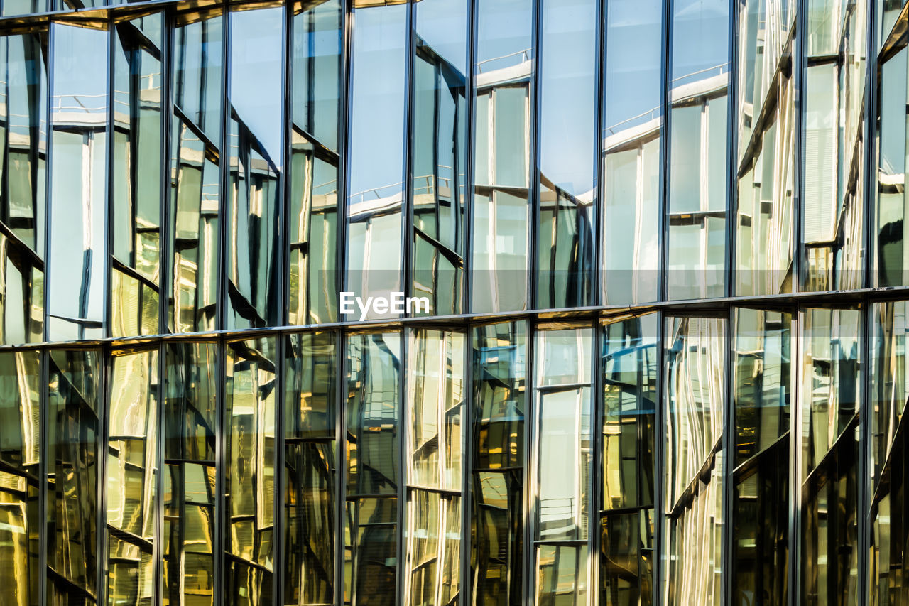 Full frame shot of reflection on glass building