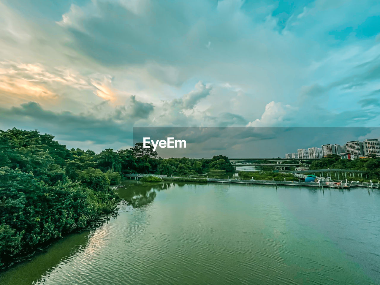 SCENIC VIEW OF RIVER AGAINST SKY AND TREES