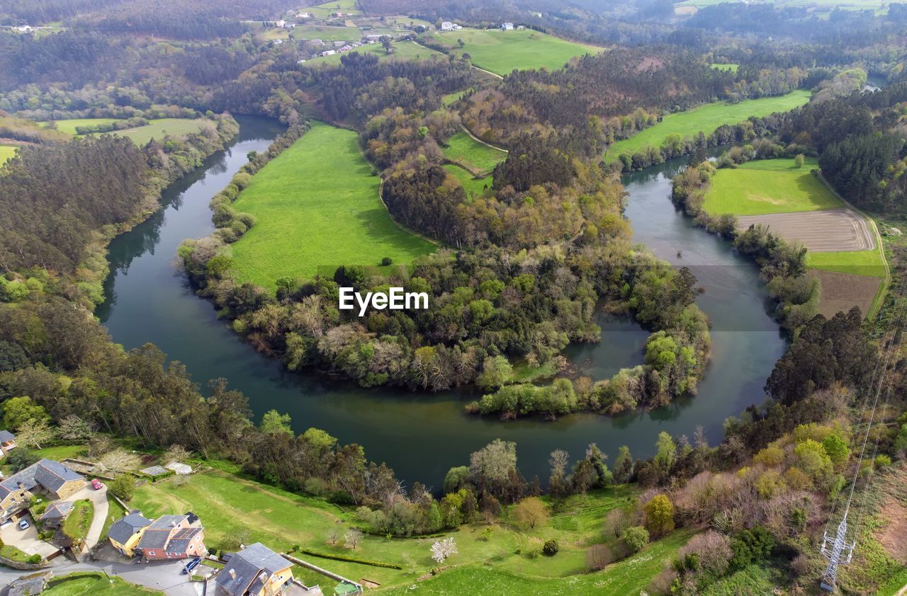 Aerial view of the meanders of the navia river in asturias, spain.