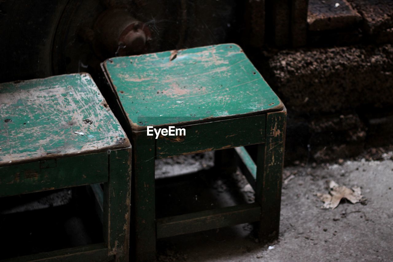 High angle view of old green stools