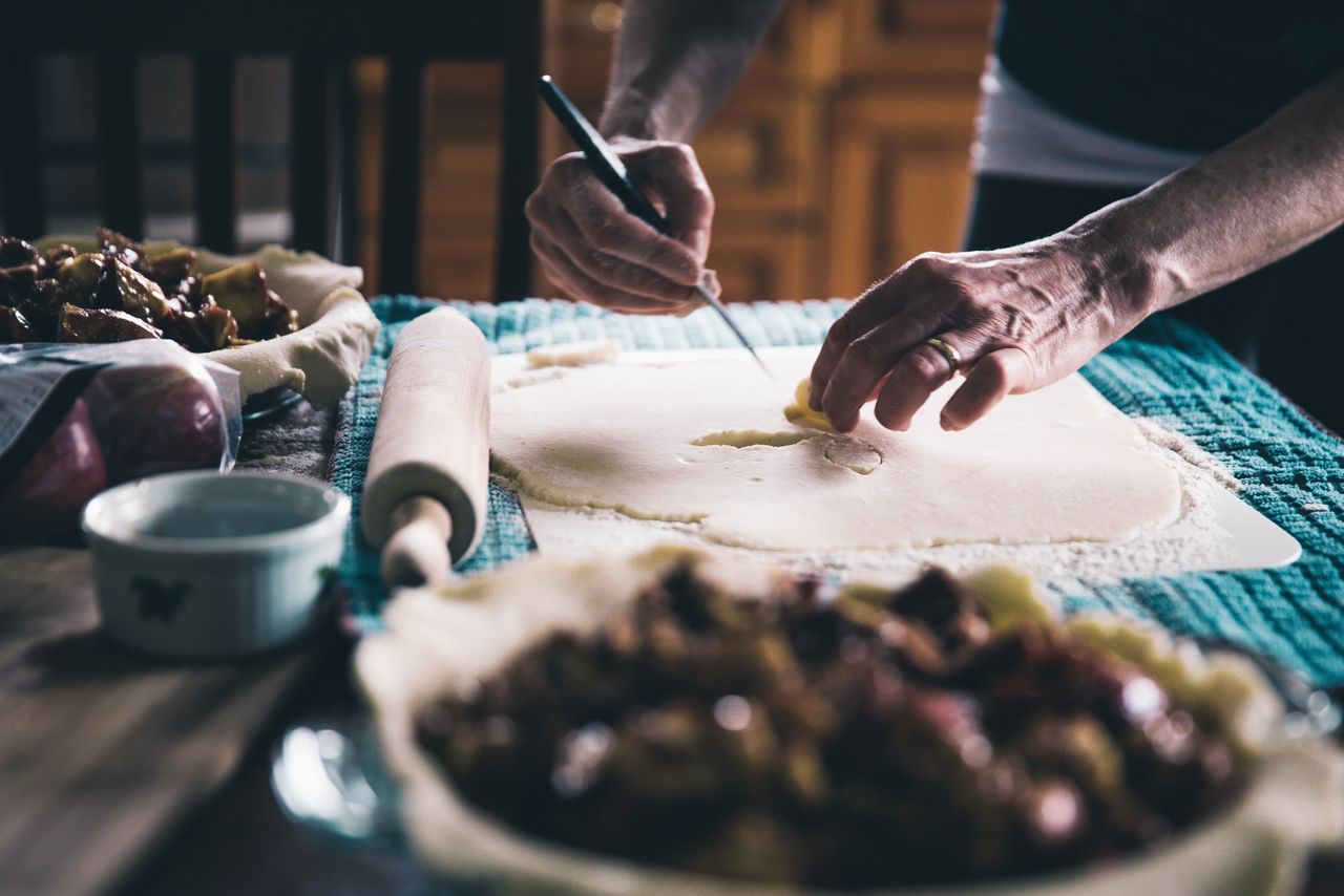 cropped hand of man preparing food