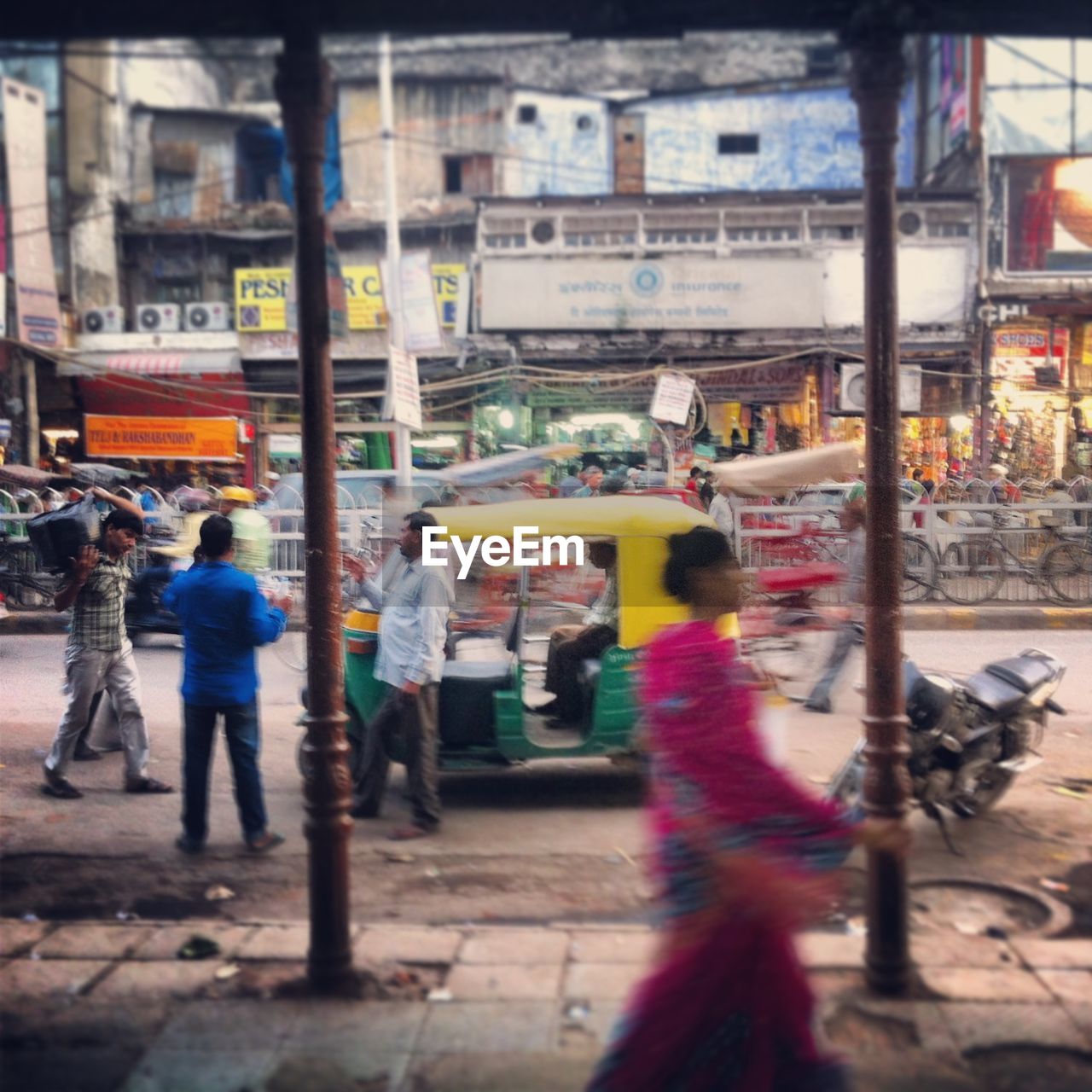 WOMAN STANDING ON CITY STREET