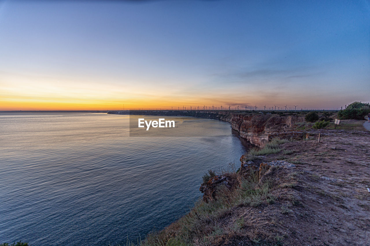 Scenic view of sea against sky during sunset