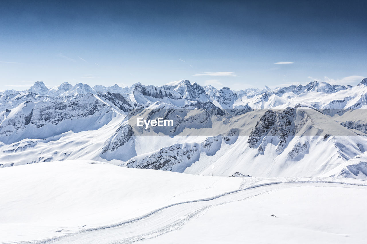 Scenic view of snowcapped mountains against sky