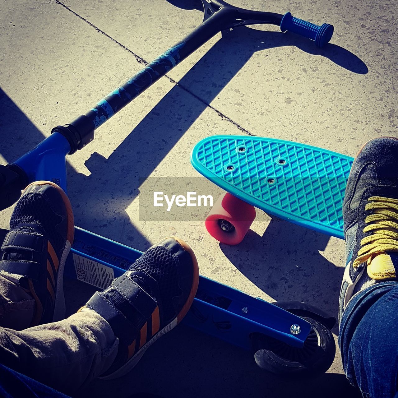 LOW SECTION OF MAN WITH UMBRELLA