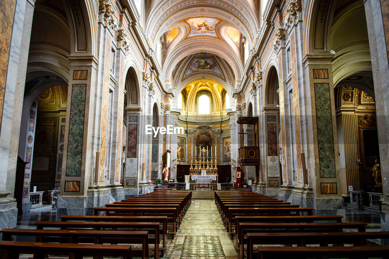 architecture, religion, spirituality, belief, built structure, place of worship, building, catholicism, pew, arch, indoors, worship, aisle, travel destinations, history, no people, the past, seat, altar, bench, architectural column, the way forward, travel