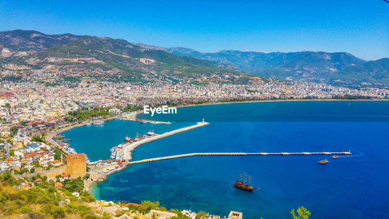 High angle view of sea and cityscape