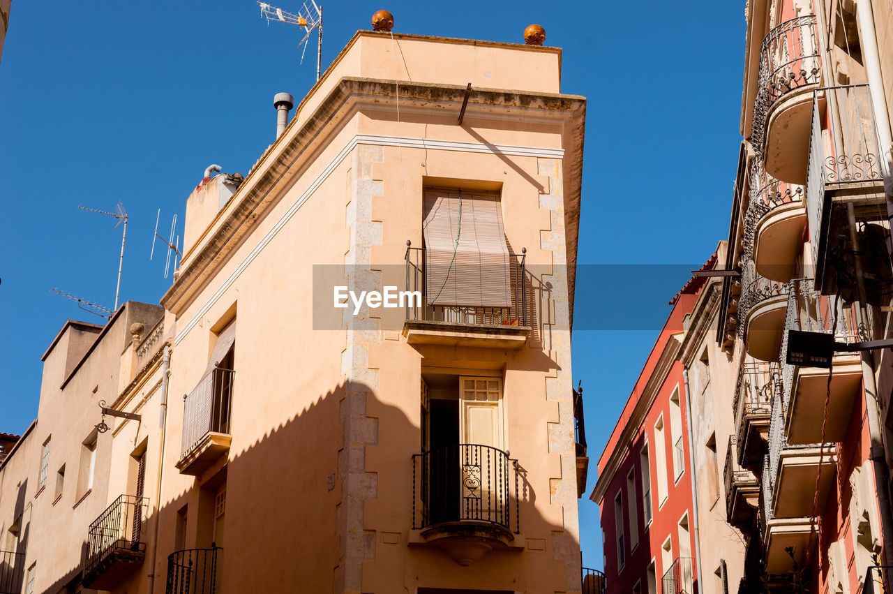 Low angle view of buildings against clear sky