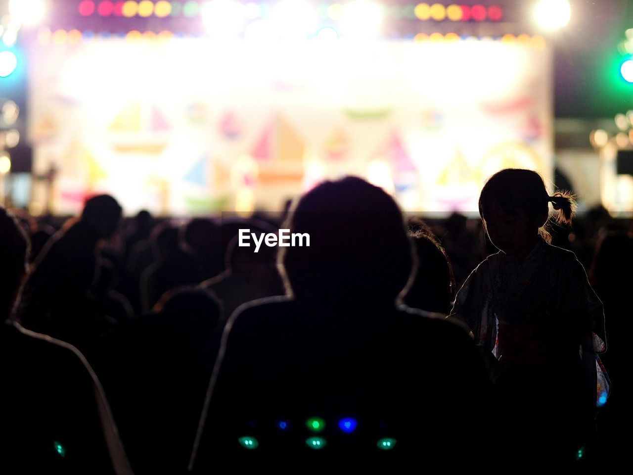 SILHOUETTE PEOPLE STANDING ON STAGE