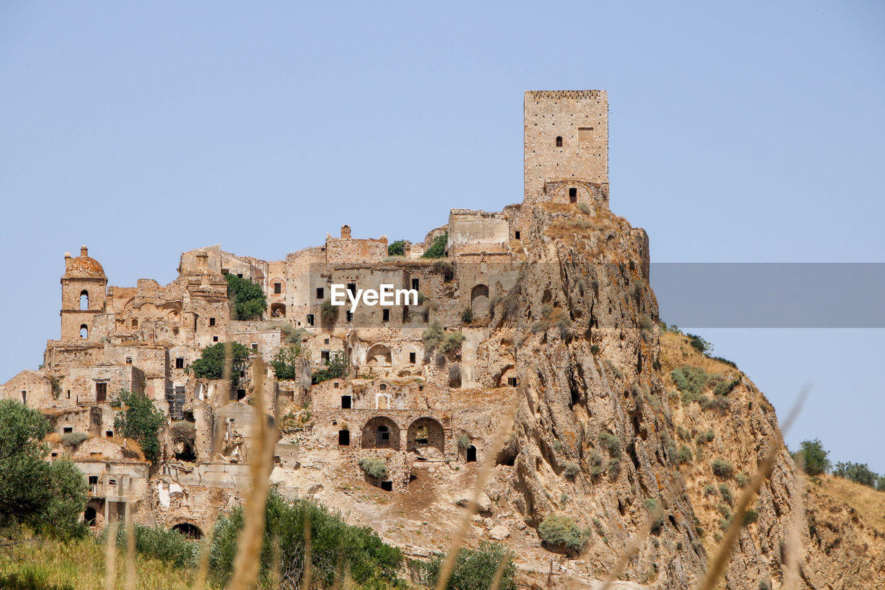 low angle view of rock formations against clear sky