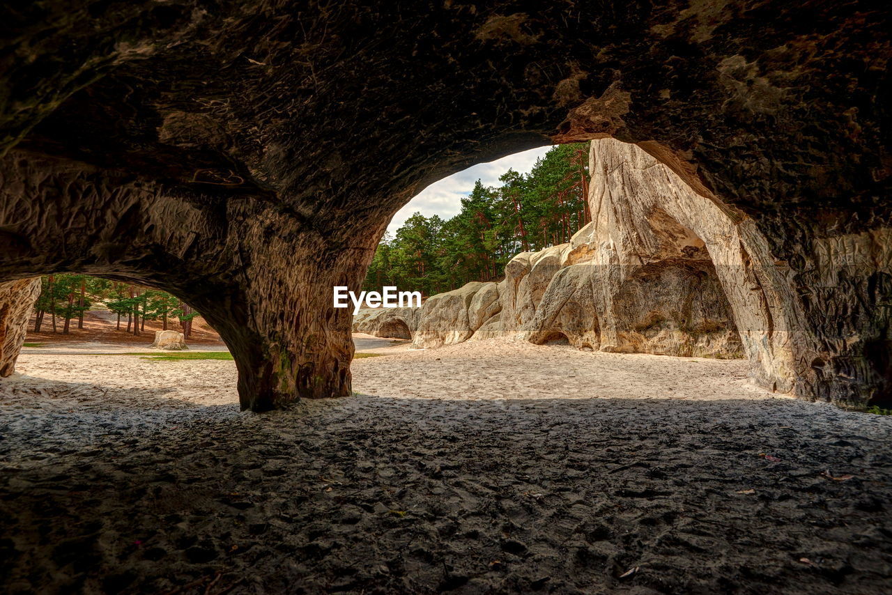 VIEW OF CAVE THROUGH ARCH