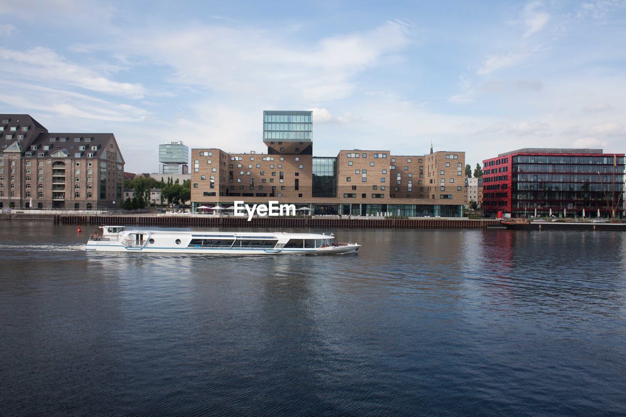 River in city against sky