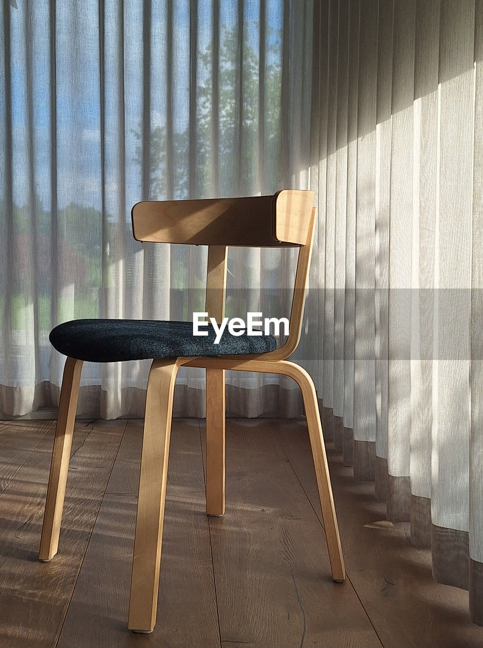 wood, seat, chair, floor, indoors, interior design, furniture, window, no people, curtain, table, absence, window covering, empty, home interior, hardwood, room, sunlight, architecture, day, flooring, nature, domestic room, shadow