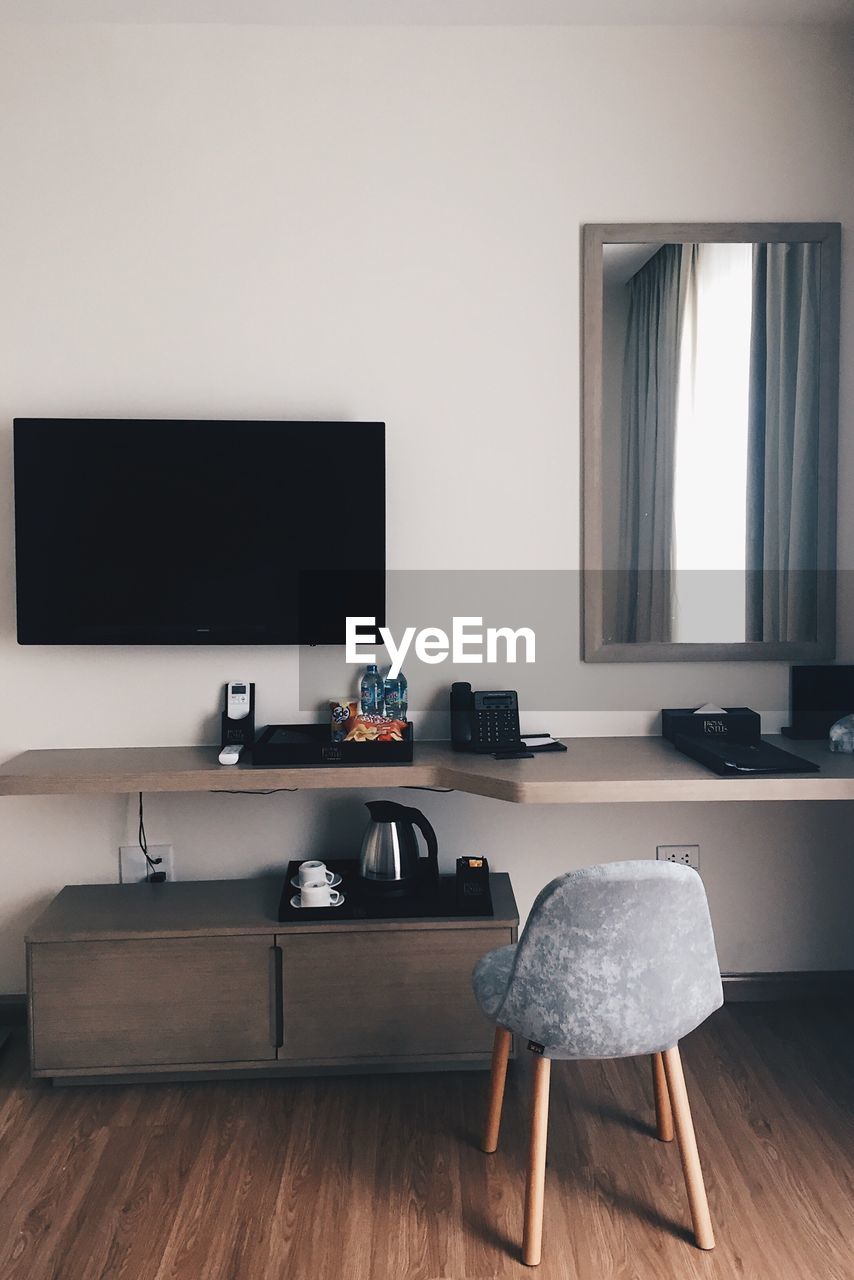 Chairs and tables on hardwood floor at home