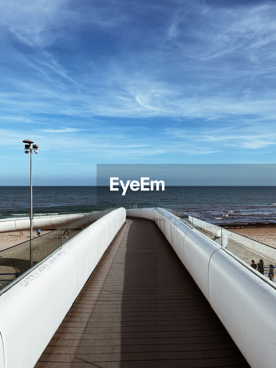 Pier over sea against sky