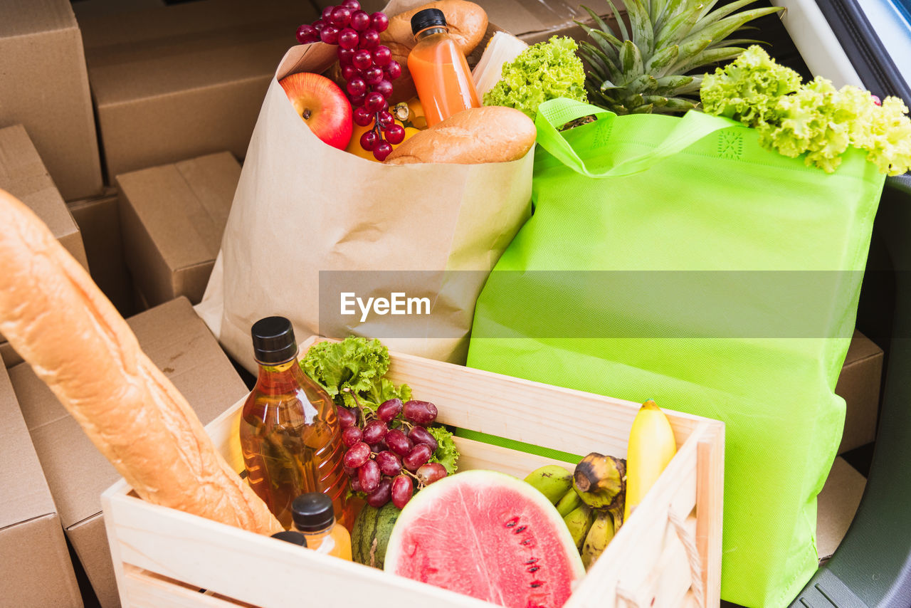 HIGH ANGLE VIEW OF FRUITS IN BOX ON TABLE