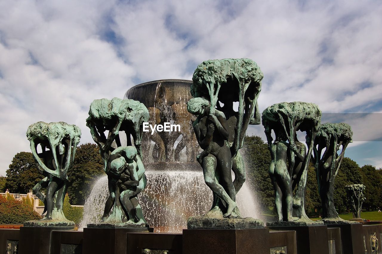 Sculpture fountain at the vigeland park against cloudy sky
