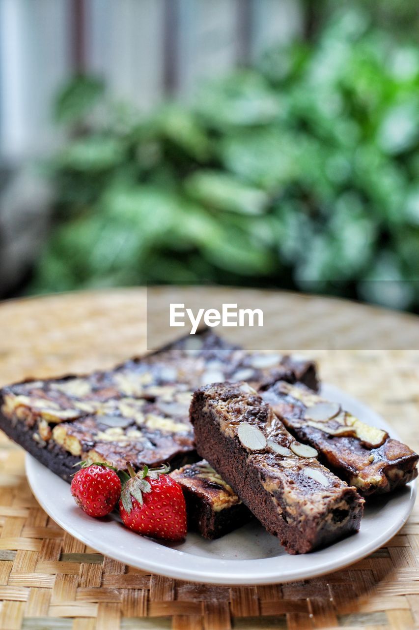 Close-up of served brownies and fruit