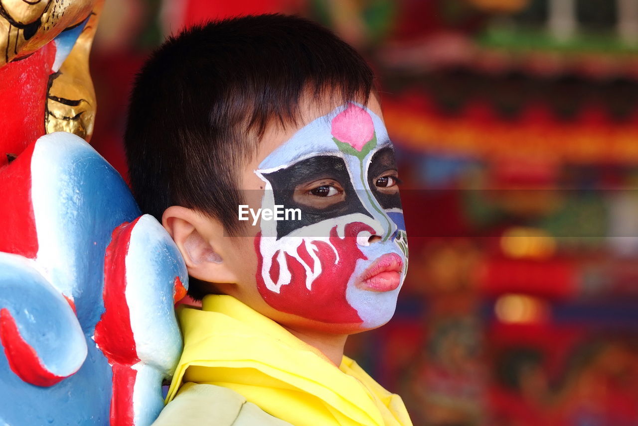 Close-up of boy wearing carnival costume