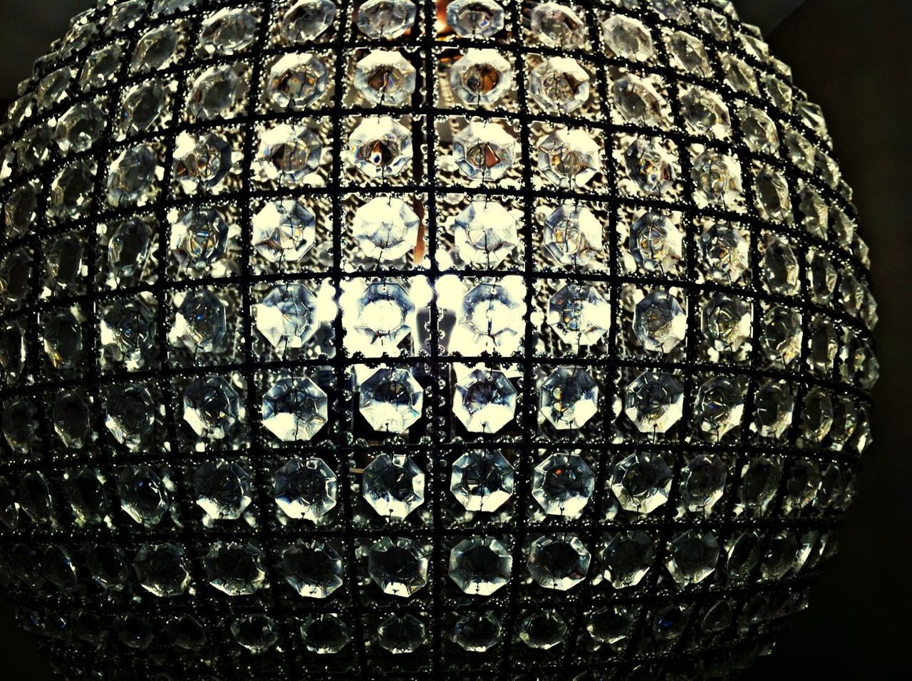 Close-up of sphere lamp against dark background