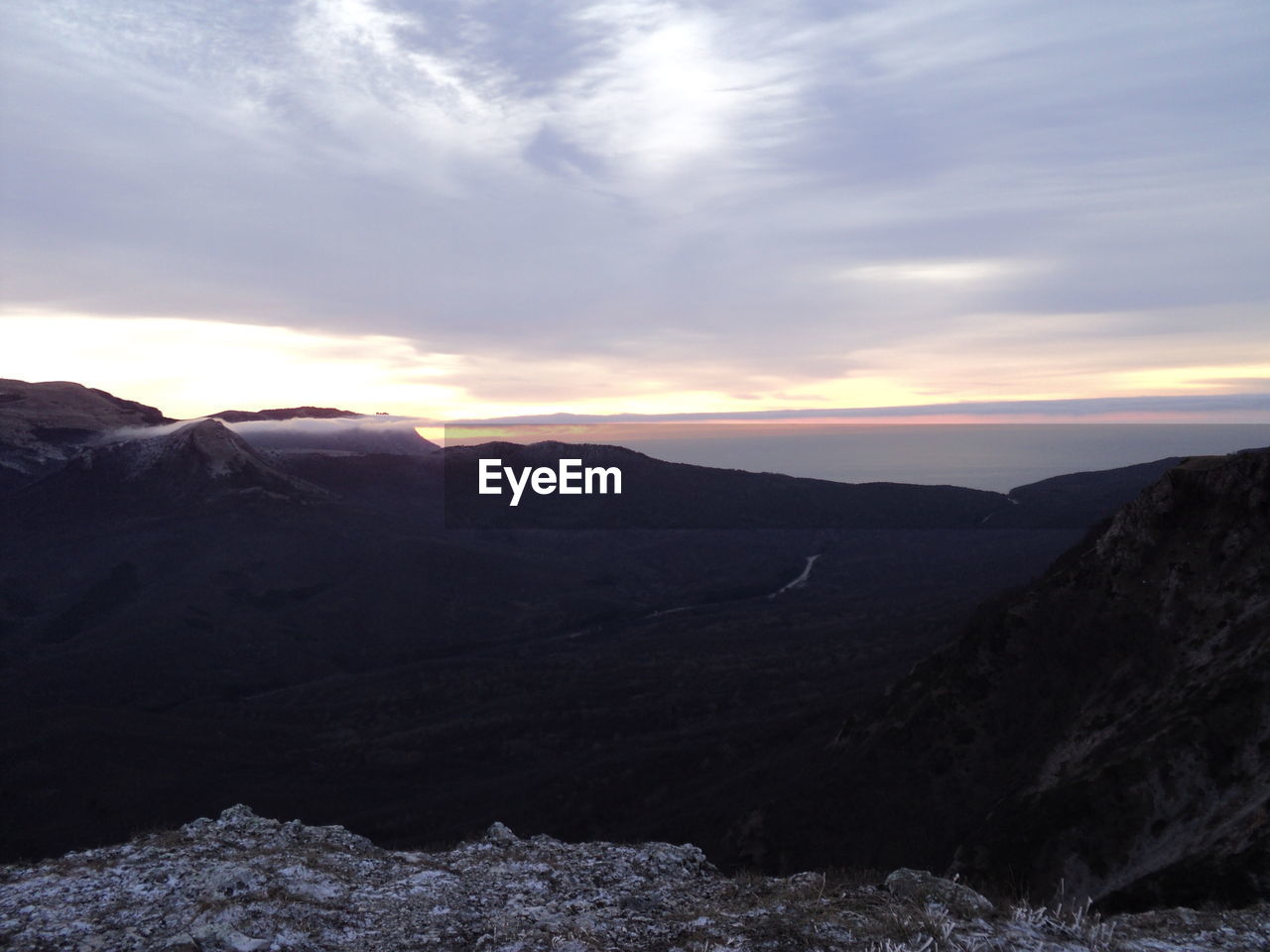 SCENIC VIEW OF LANDSCAPE AGAINST SKY DURING SUNSET