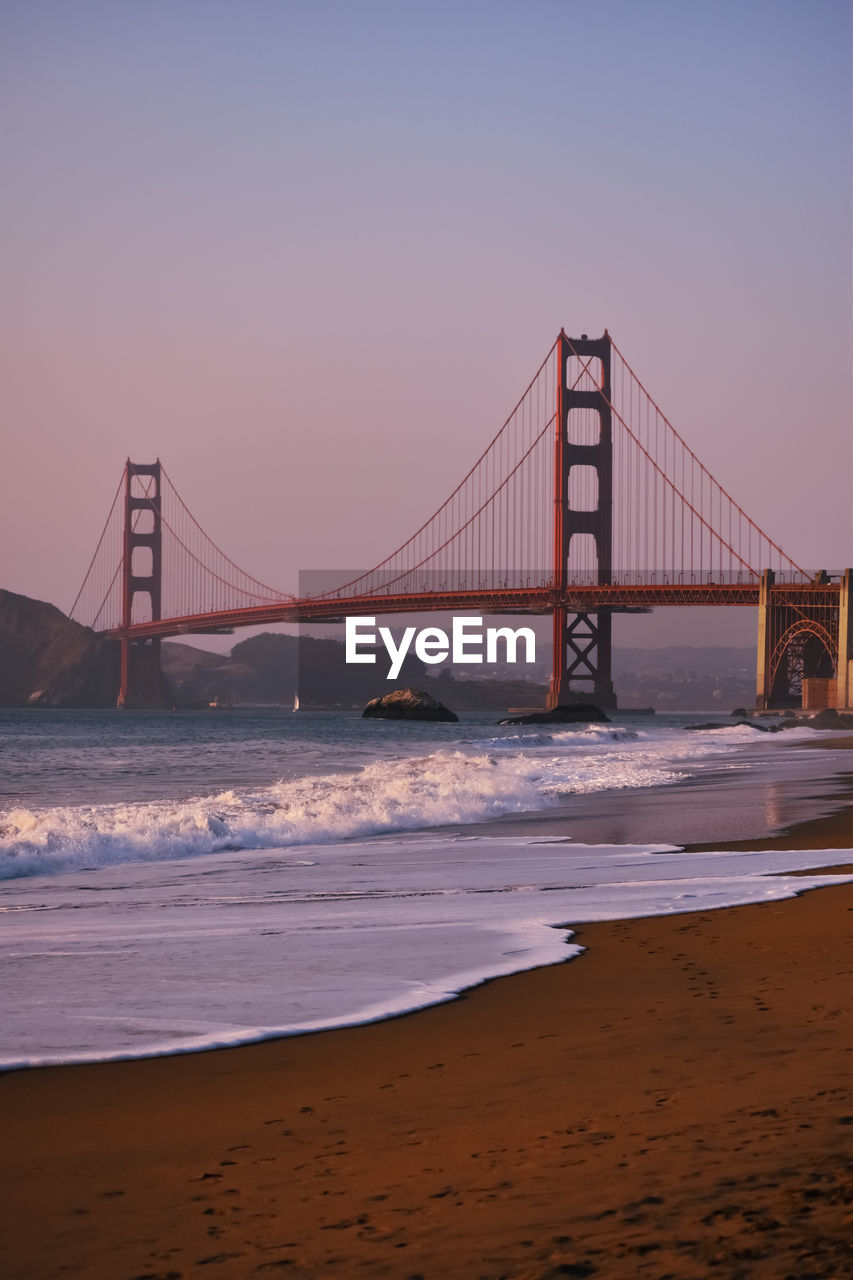 View of suspension bridge at sunset