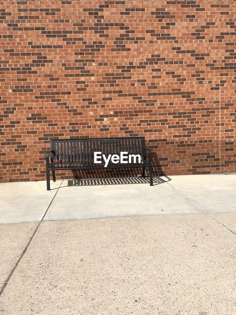 EMPTY BRICK WALL WITH BUILDING