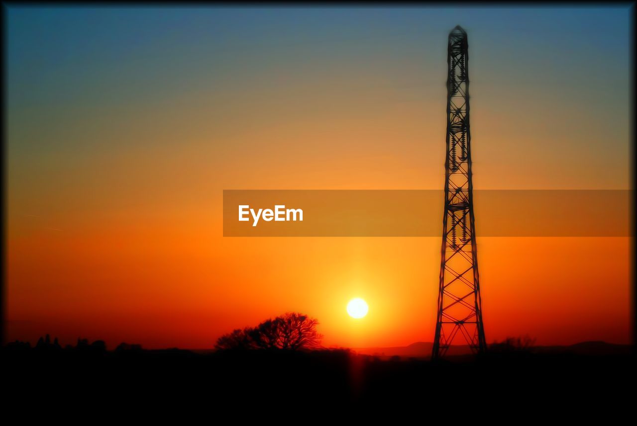 SILHOUETTE OF TREES AGAINST SKY DURING SUNSET