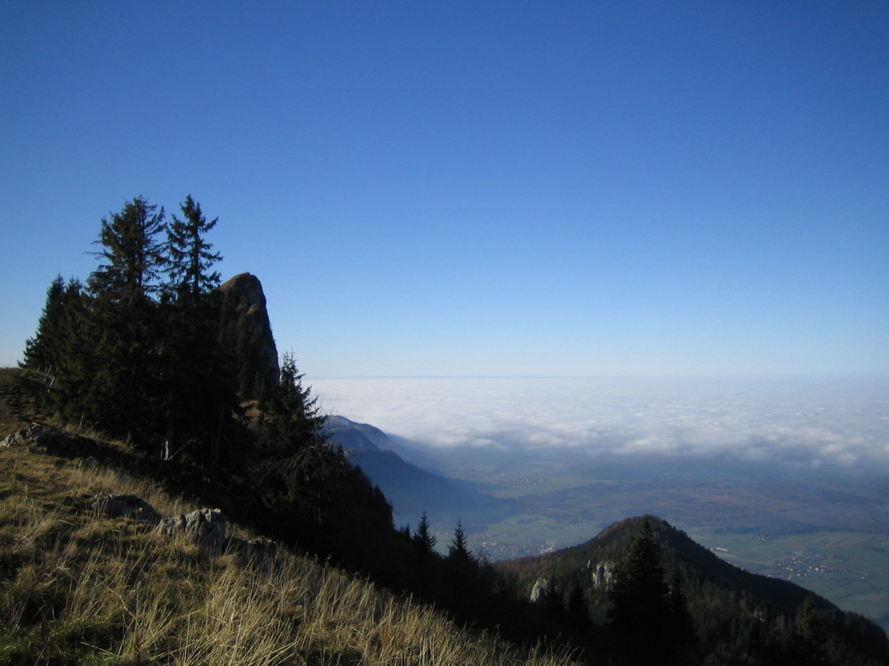 Scenic view of mountains against blue sky