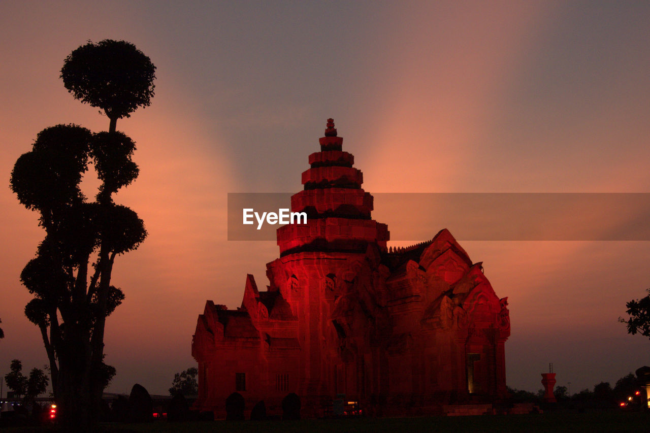 SILHOUETTE OF TEMPLE AGAINST SKY AT SUNSET