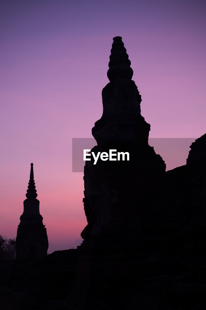 Low angle view of silhouette temple against sky at sunset