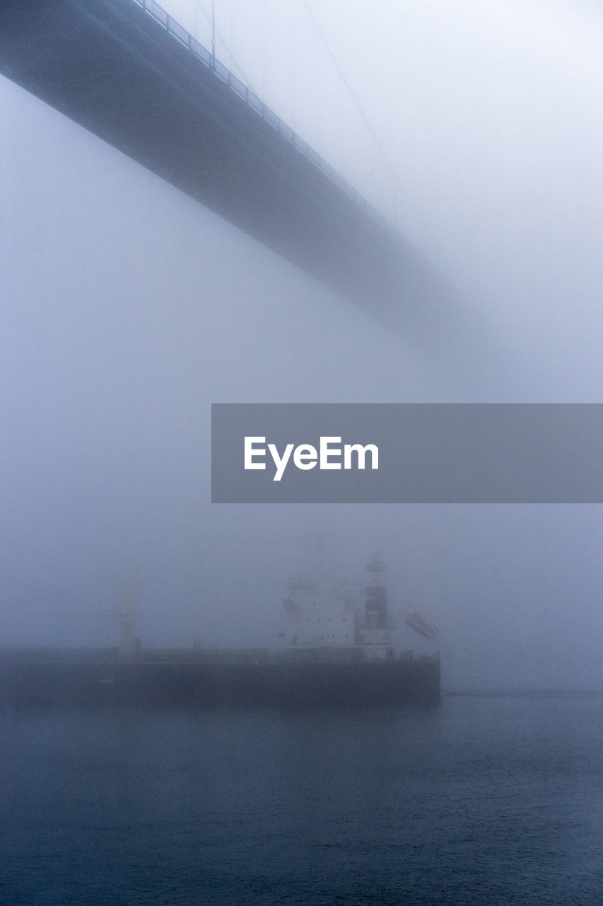 SEA AGAINST SKY DURING FOGGY WEATHER