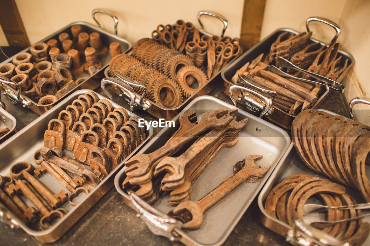 High angle view of various rusty work tools