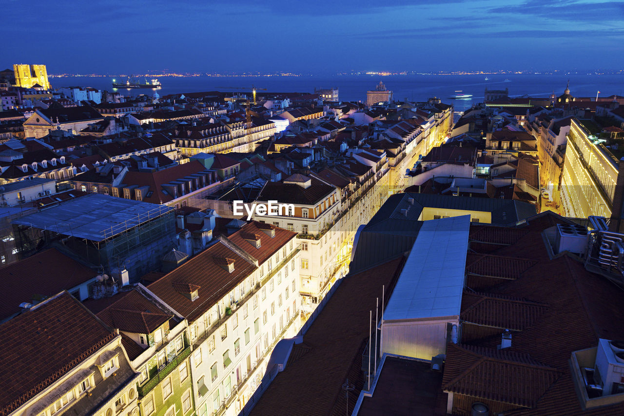 high angle view of illuminated cityscape against sky