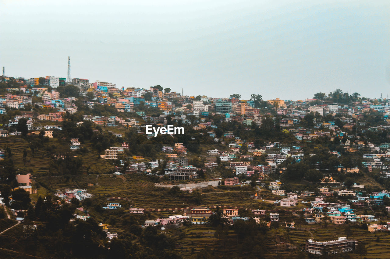 A landscape of a city in the mountains, captured from a tele photo lens.