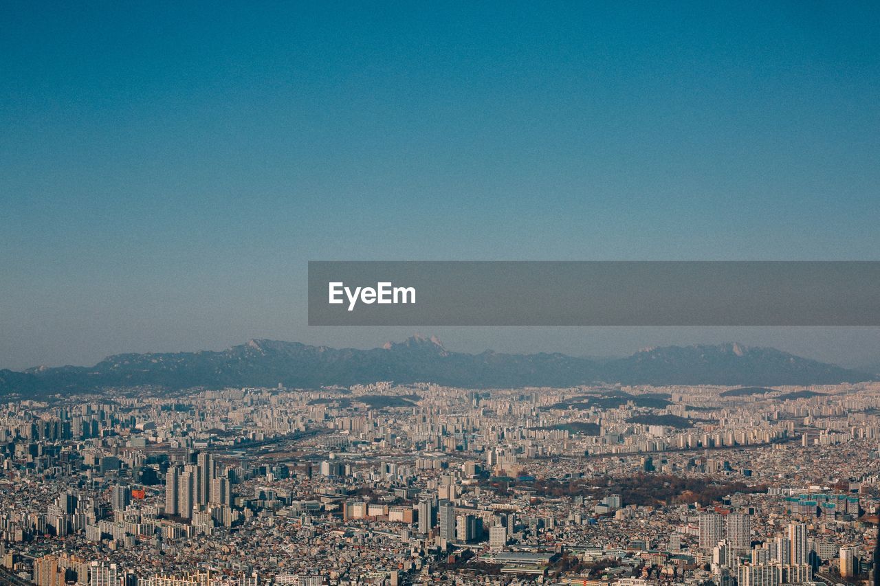 High angle shot of townscape against sky