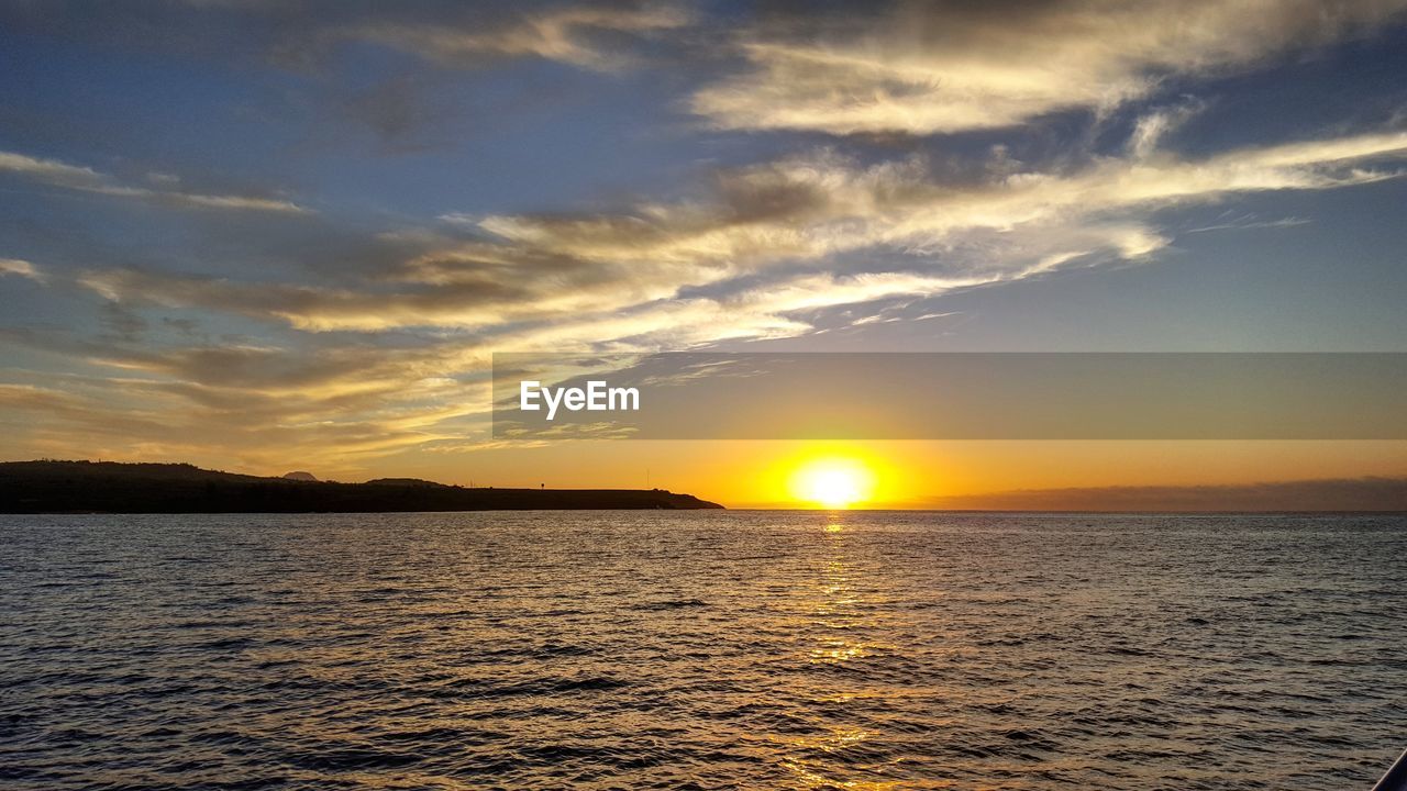 SCENIC VIEW OF SEA AGAINST DRAMATIC SKY