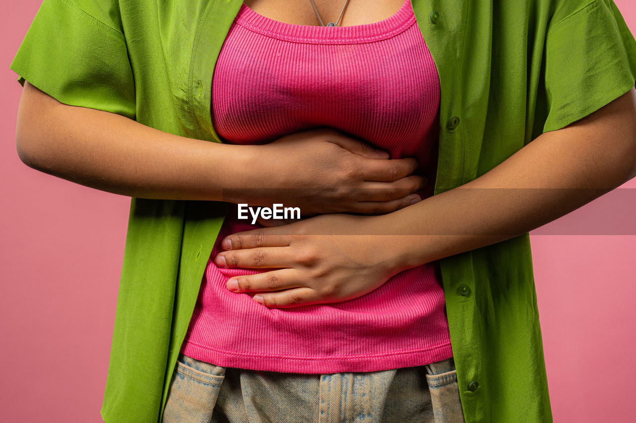 midsection of woman wearing sweater