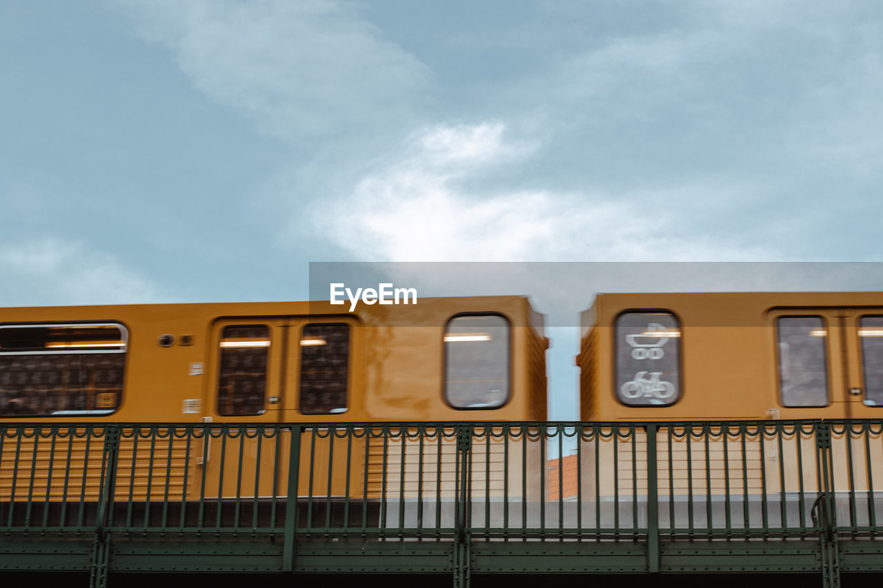 low angle view of train on road against sky