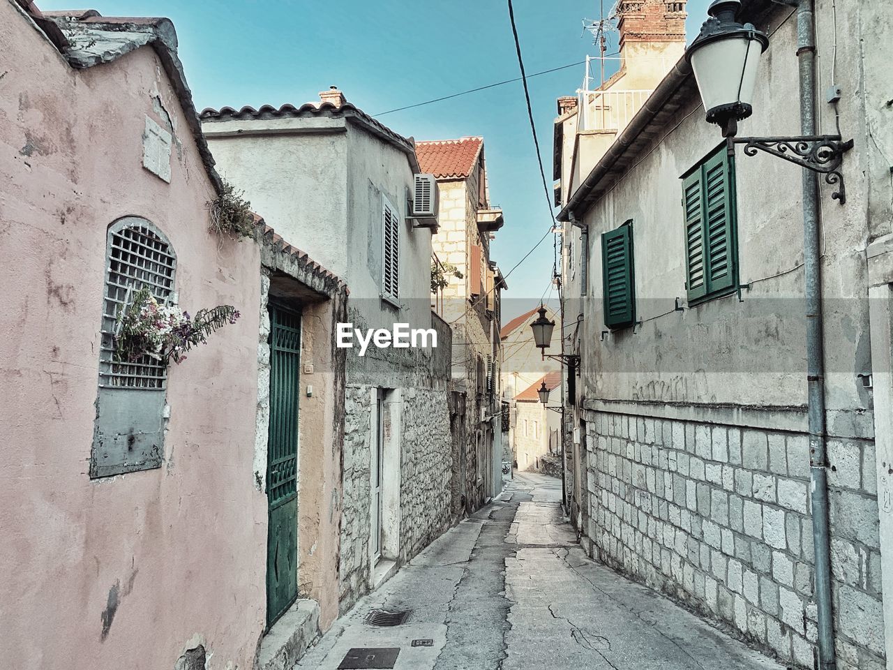 Footpath amidst buildings in town