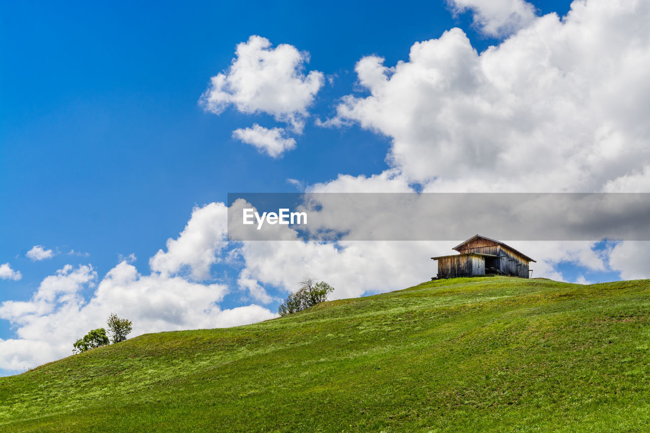 House on field against sky